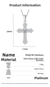 Detail of S925 silver cross pendant with sparkling zircons and white gold finish