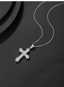 Detailed close-up of a vintage S925 silver cross pendant with shimmering zircon crystals