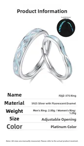 Detail view of S925 sterling silver couple rings with blue fluorescent luminous effect