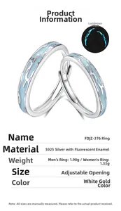 Detailed view of S925 silver couple rings with blue fluorescent flame effect and open design