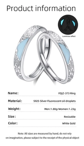 Macro detail of S925 sterling silver couple rings with luminous blue fluorescent inlay