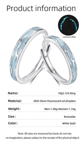 Macro view of S925 sterling silver couple ring with fluorescent blue drip oil design