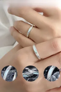 Macro detail of 925 silver rings showing fluorescent blue enamel and polished mirror finish