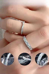 Macro detail of S925 silver rings with glowing enamel inlay and hand-polished finish