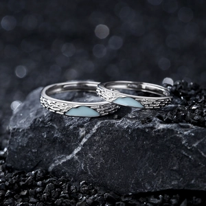 Fluorescent glacier couples rings in 925 silver with blue enamel mountain and hammered texture