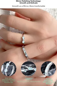 Detailed macro view showing the luminous butterfly bow ring and geometric silver band set