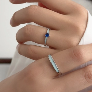 S925 silver couple rings set with heart-shaped blue zircon and wave texture design