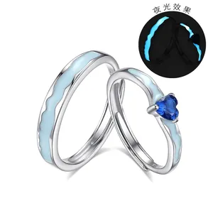 Luminous S925 sterling silver couple rings with blue heart zircon and wave pattern