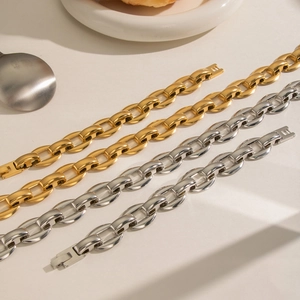 Polished gold and silver chunky chain link bracelets in a sleek stainless steel finish