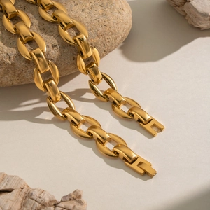 Chunky gold U-link chain necklace with high-polish finish and secure folding clasp