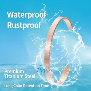 Rose gold stainless steel C-shape open cuff bracelet with dynamic water splash background