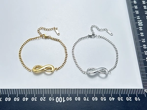 Detailed comparison of gold and silver infinity bracelets with stainless steel chains