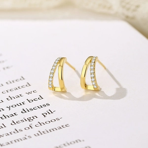 Elegant gold double-row zircon stud earrings with polished finish and pavé setting