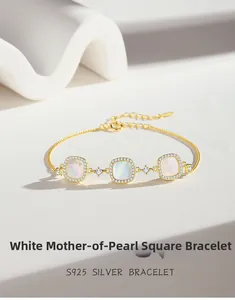Macro detail of S925 silver bracelet featuring square white shells and pavé zircon settings