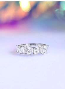 Macro shot of S925 silver ring featuring heart and pear-shaped zircon stones