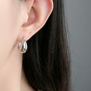 Polished silver teardrop earrings for women in a minimalist geometric style