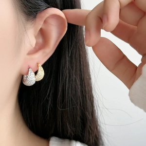 Luxe hollow pave diamond hoop earrings in gold and silver plating for women