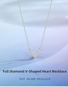 Close-up of S925 sterling silver V-shaped heart pendant with sparkling pavé diamonds