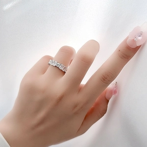 Sparkling S925 silver ring featuring baguette and round cubic zirconia in a paved design