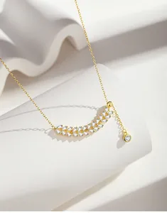 Macro detail of S925 silver necklace with golden wheat ear pendant and zircon stones