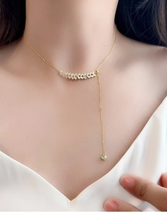 Detail of S925 silver wheat zircon Y-necklace with adjustable tassel and gold finish