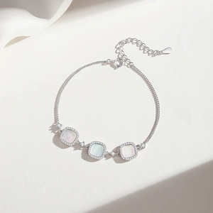 Elegant S925 sterling silver bracelet featuring three square white shell charms and zircons