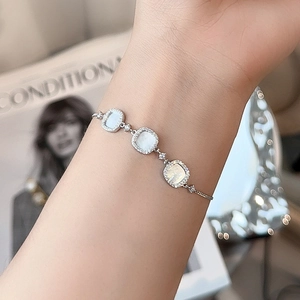 S925 silver bracelet featuring white shell square charms and micro-pave crystals