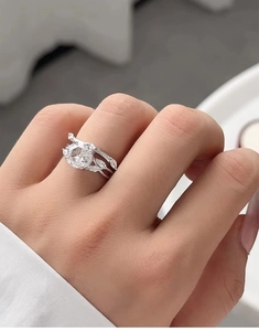 Close-up of S925 silver bridal ring set with round brilliant stone and marquise diamonds