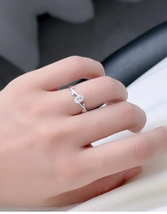 Detailed close-up of the elegant silver leaf-style ring with oval cubic zirconia stone