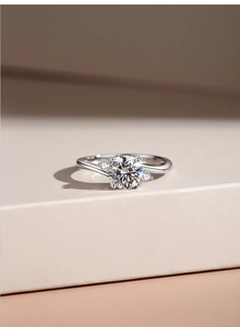 Close-up of elegant S925 silver ring featuring round-cut moissanite and three-stone design