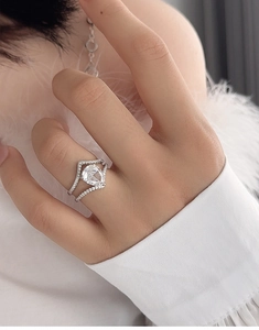 Detailed close-up of S925 sterling silver pear-shaped diamond engagement ring set