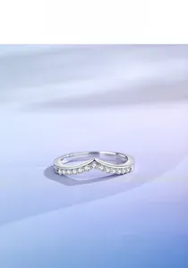 Macro detail showing S925 hallmark on a polished V-shaped silver band with pave diamonds