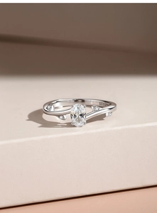 Macro shot of S925 sterling silver stamp on leaf-inspired oval cut engagement ring