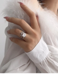 Close-up of S925 silver bridal ring set with radiant cut stone on model hand