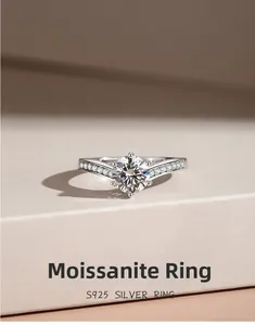 Close-up of six-prong moissanite ring with side diamonds on S925 silver band