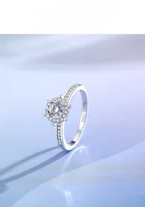 Detail of S925 sterling silver crown ring featuring a large halo-set Moissanite stone