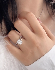 Macro detail of S925 silver cushion cut bridal set ring with sparkling wave accent band