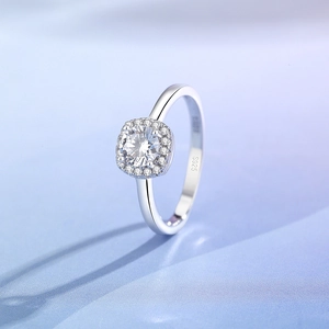 Classic S925 sterling silver halo ring with round moissanite on blue silk background