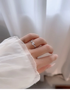 Detailed view of an S925 silver ring with a large rectangular zircon and side stones