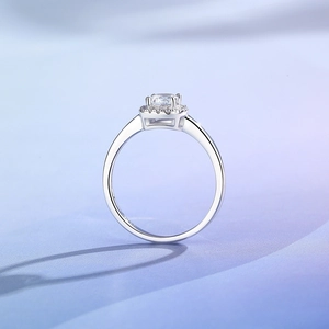 Classic S925 sterling silver ring with halo moissanite stone on blue silk background