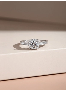 Macro shot of S925 sterling silver ring showing the hallmark and halo diamond setting