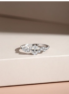 Macro detail of S925 sterling silver stamp and oval zircon gemstone on the ring