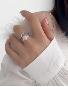 Elegant S925 silver bridal ring set featuring a pear-cut diamond on a model's hand