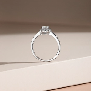 Luxurious S925 sterling silver halo moissanite engagement ring on a geometric stand