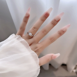Elegant S925 silver moissanite ring worn by a model with soft lighting and lace cuff