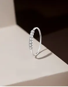 Detail of S925 sterling silver ring featuring seven prong-set round cubic zirconia stones