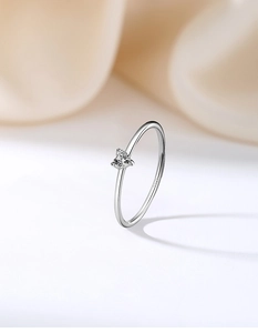 Detailed macro view of S925 sterling silver stamp on minimalist 1mm heart zircon ring