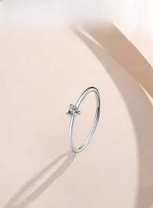 Macro shot of S925 sterling silver minimalist ring with heart-shaped zircon and hallmark