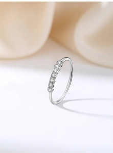 Macro view of S925 sterling silver ring featuring a row of six sparkling round cubic zirconia