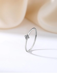 Macro shot of S925 sterling silver stamp and round zircon in classic four-prong setting